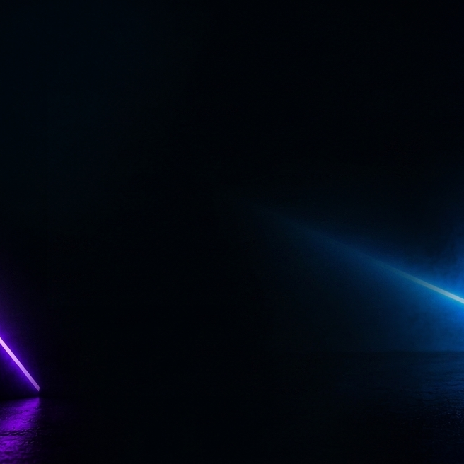 Black gaming headset on a stand with neon lights in a dark room